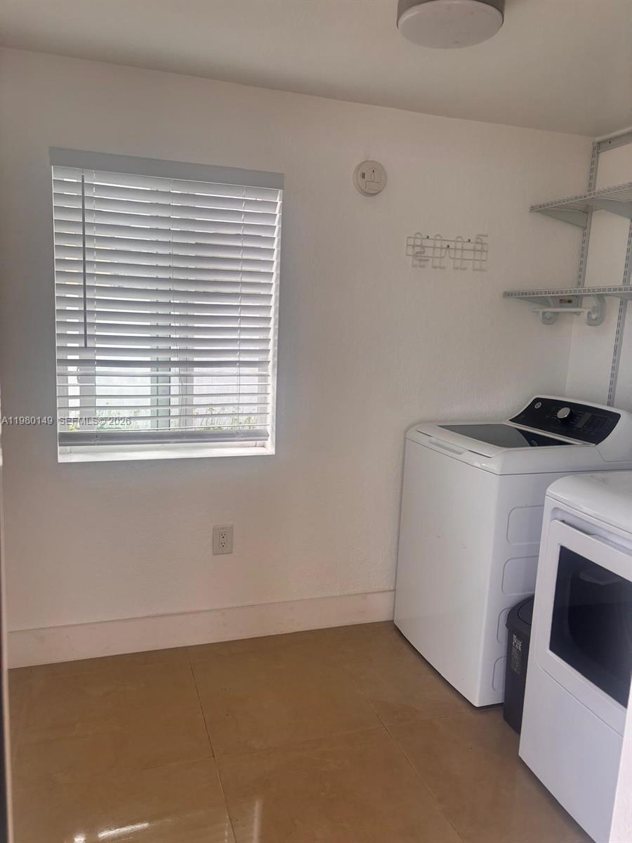 30001 Southwest 153rd Avenue Homestead, FL 33033 - Photo 53 of 55 a view of storage and utility room with washer and dryer