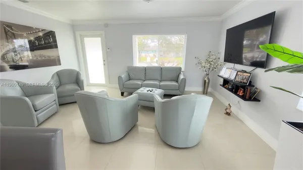 a living room with furniture and a window