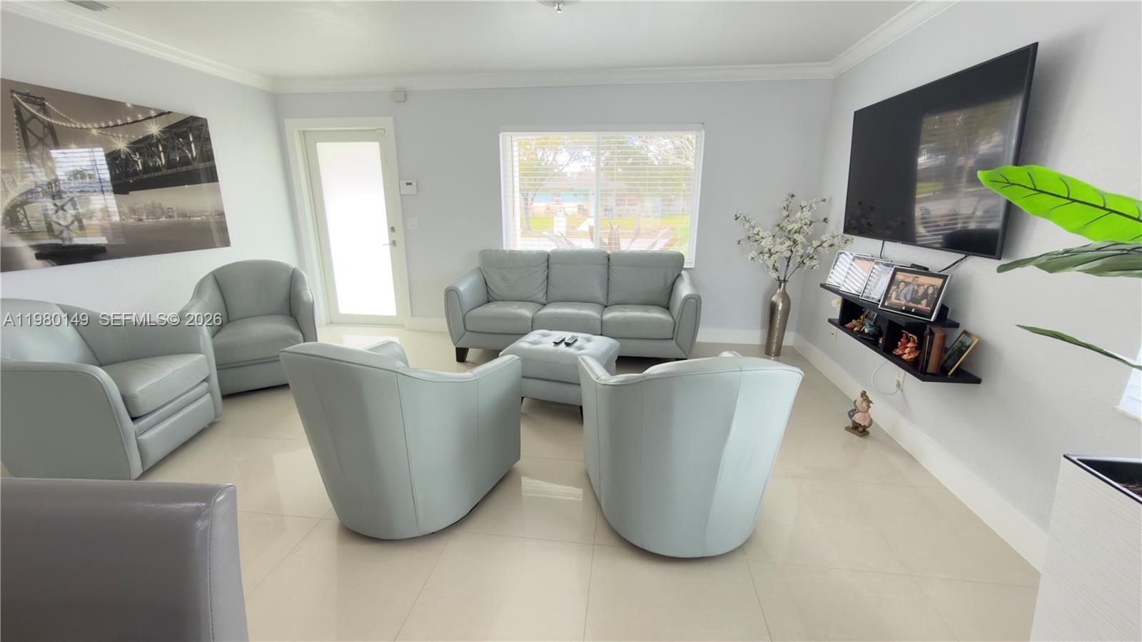 30001 Southwest 153rd Avenue Homestead, FL 33033 - Photo 8 of 55 a living room with furniture and a window