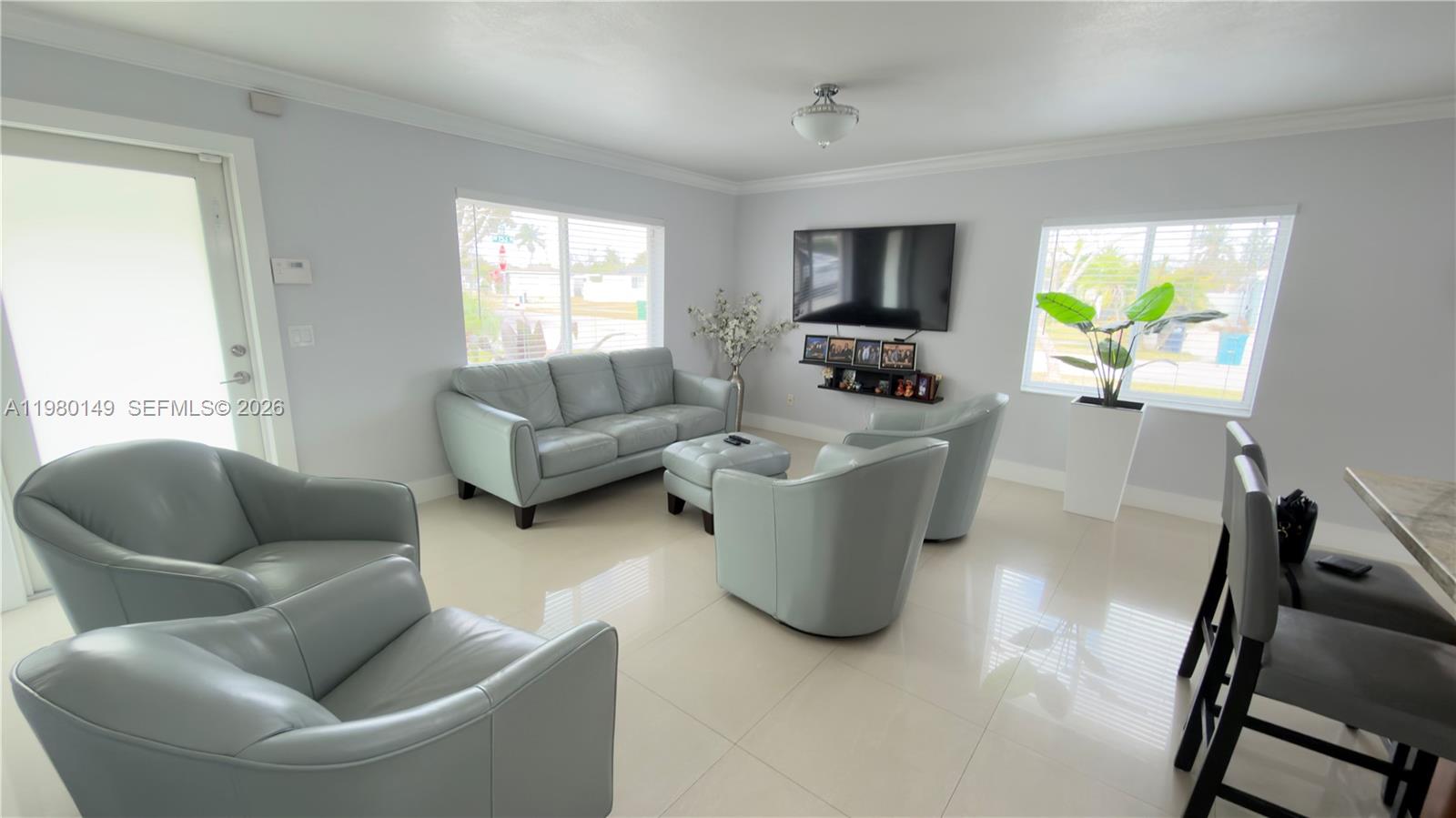 30001 Southwest 153rd Avenue Homestead, FL 33033 - Photo 9 of 55 a living room with furniture and a window