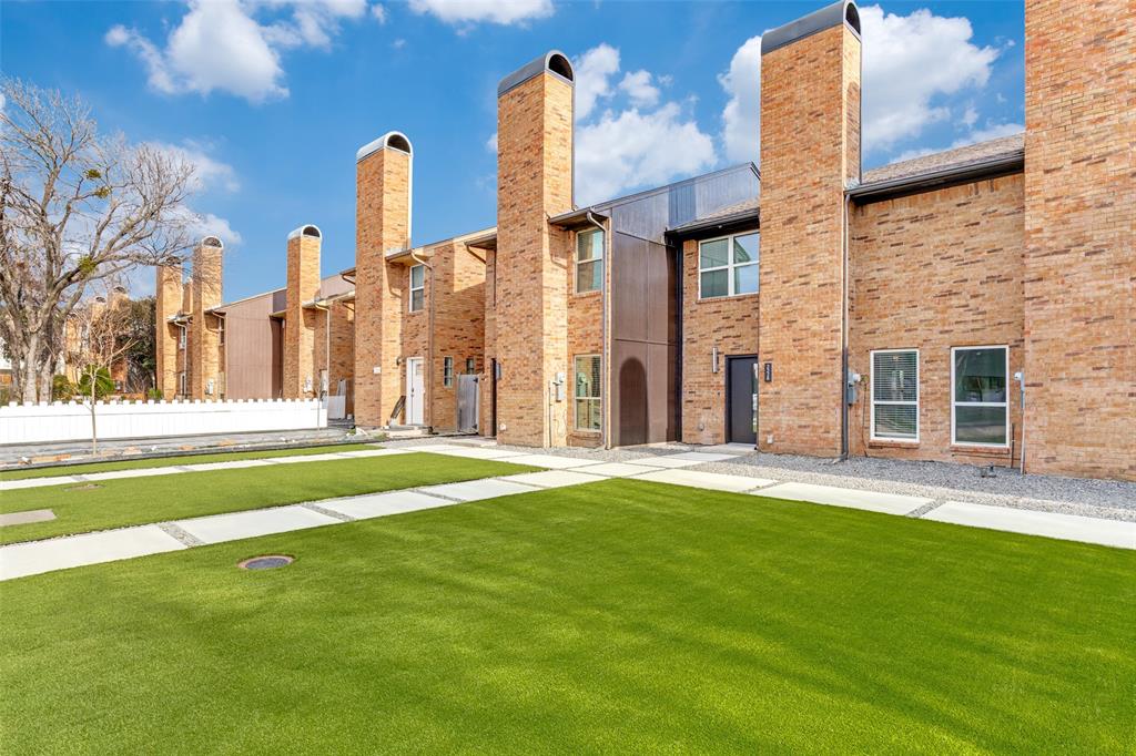 2228 Colony Court Dallas, TX 75235 - Photo 1 of 14 a view of a building with a yard