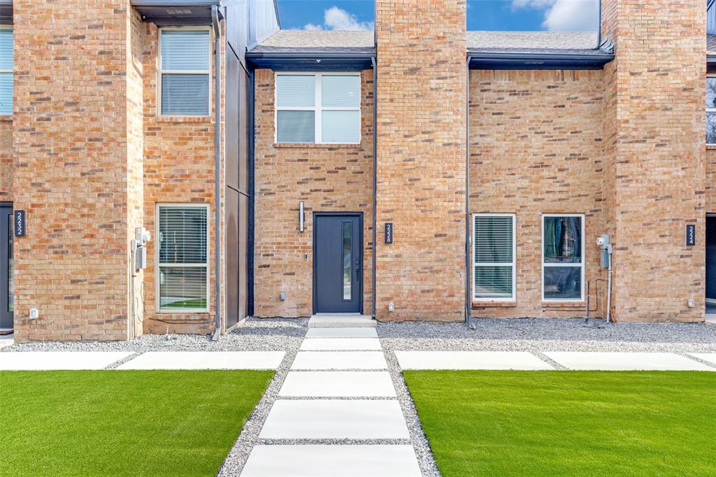 2228 Colony Court Dallas, TX 75235 - Photo 2 of 14 a front view of a house with a yard