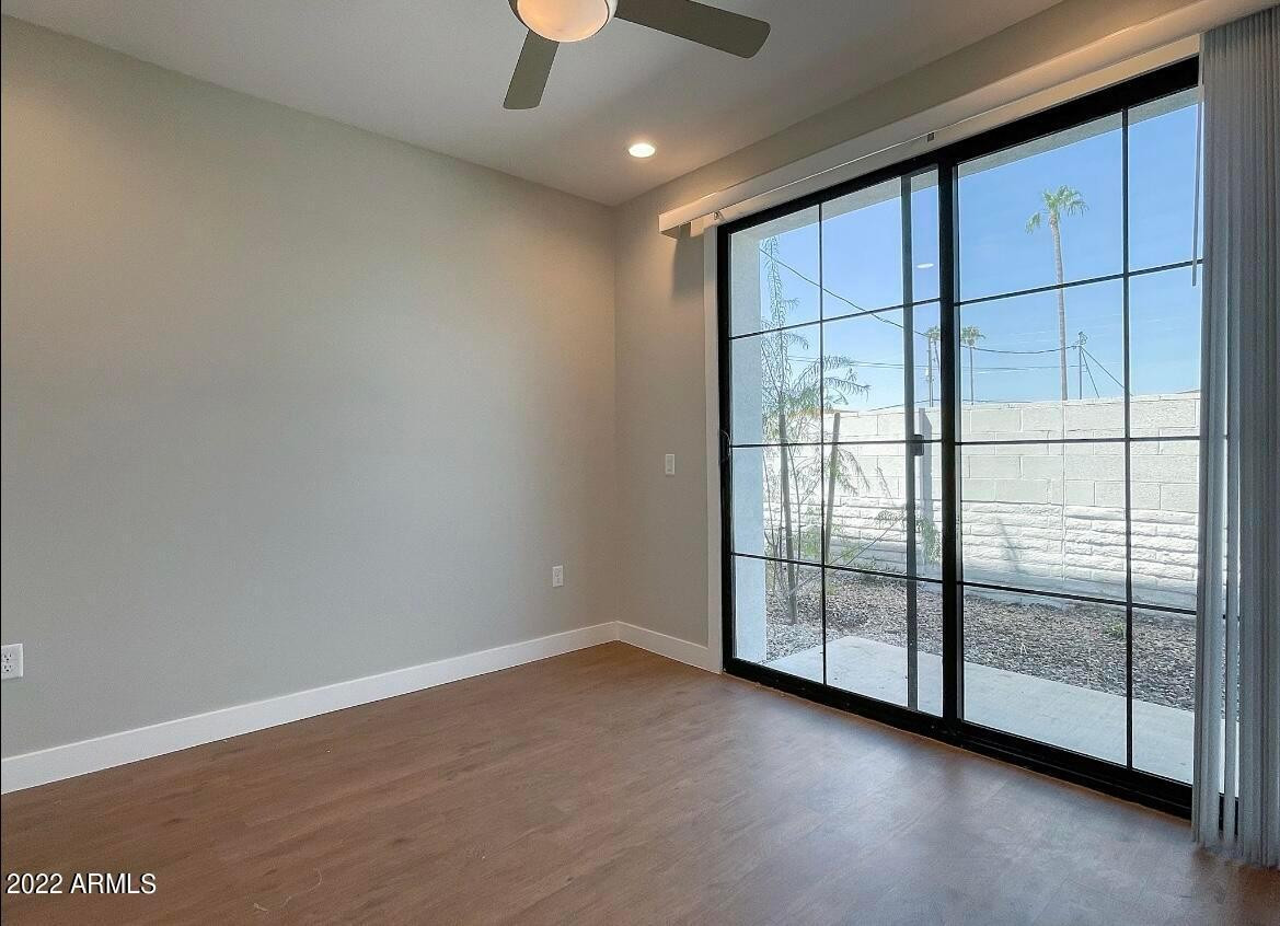 3215 East Flower Street, Unit 10 Phoenix, AZ 85018 - Photo 20 of 50 a view of an empty room with glass door