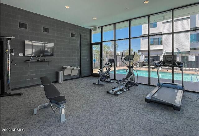 3215 East Flower Street, Unit 10 Phoenix, AZ 85018 - Photo 9 of 50 a view of a room with gym equipment