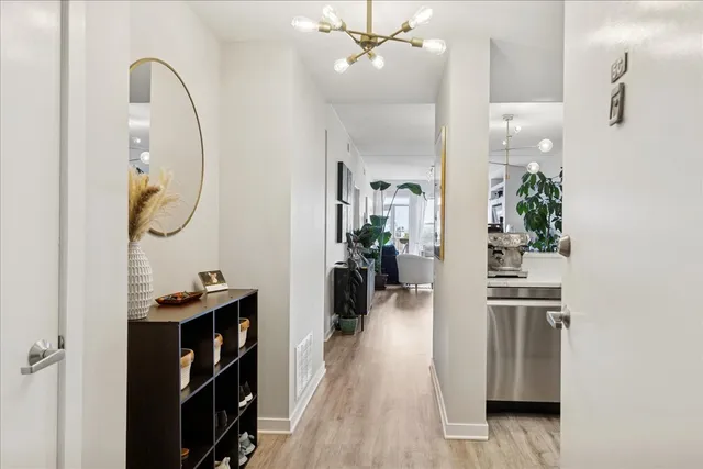 a view of a kitchen from the hallway