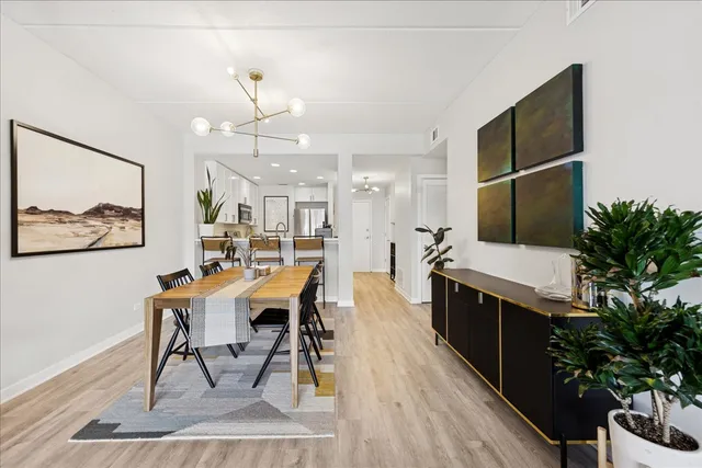 a view of a dining room with furniture and wooden floor