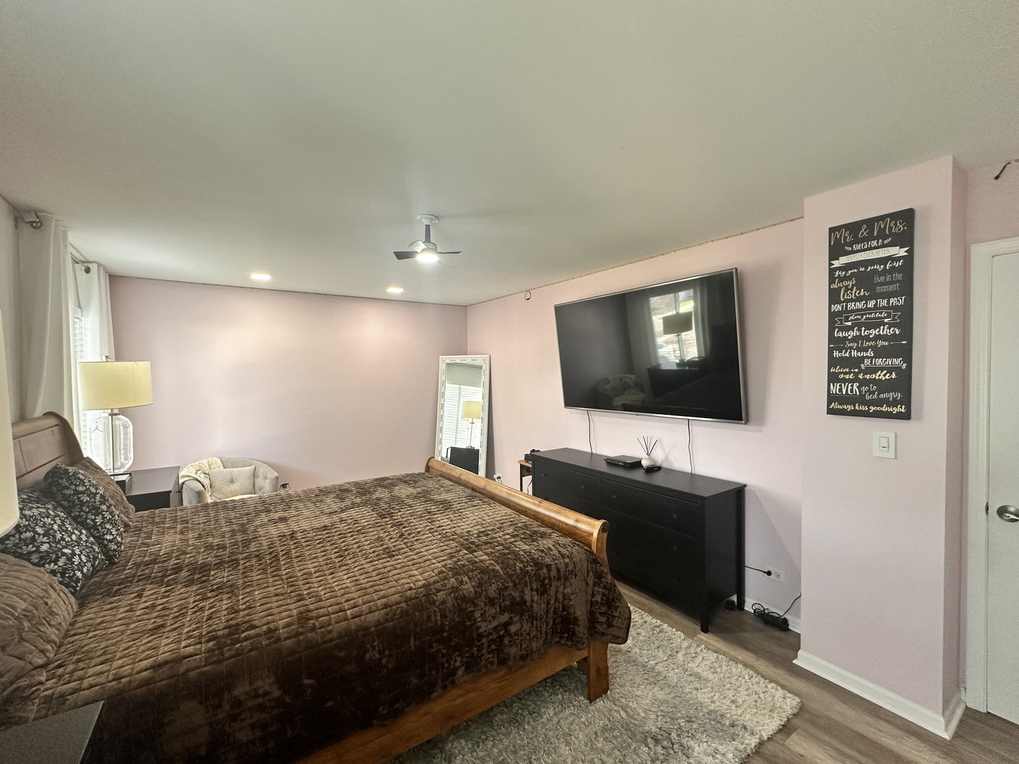 2214 Andrew Trail Montgomery, IL 60538 - Photo 13 of 28 a bedroom with a bed and a flat screen tv