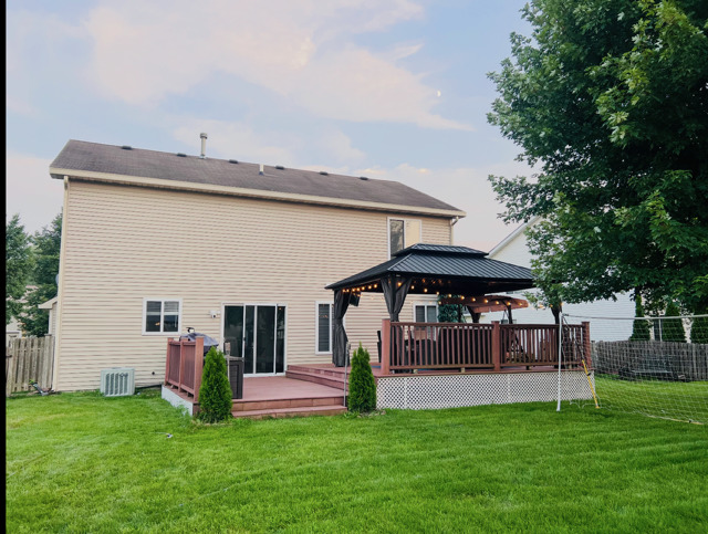 2214 Andrew Trail Montgomery, IL 60538 - Photo 24 of 28 a view of a house with a yard and sitting area