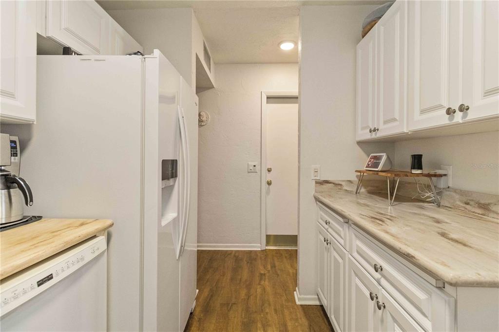 672 White Pine Tree Road, Unit 57 Venice, FL 34285 - Photo 11 of 57 a kitchen with a sink and a refrigerator