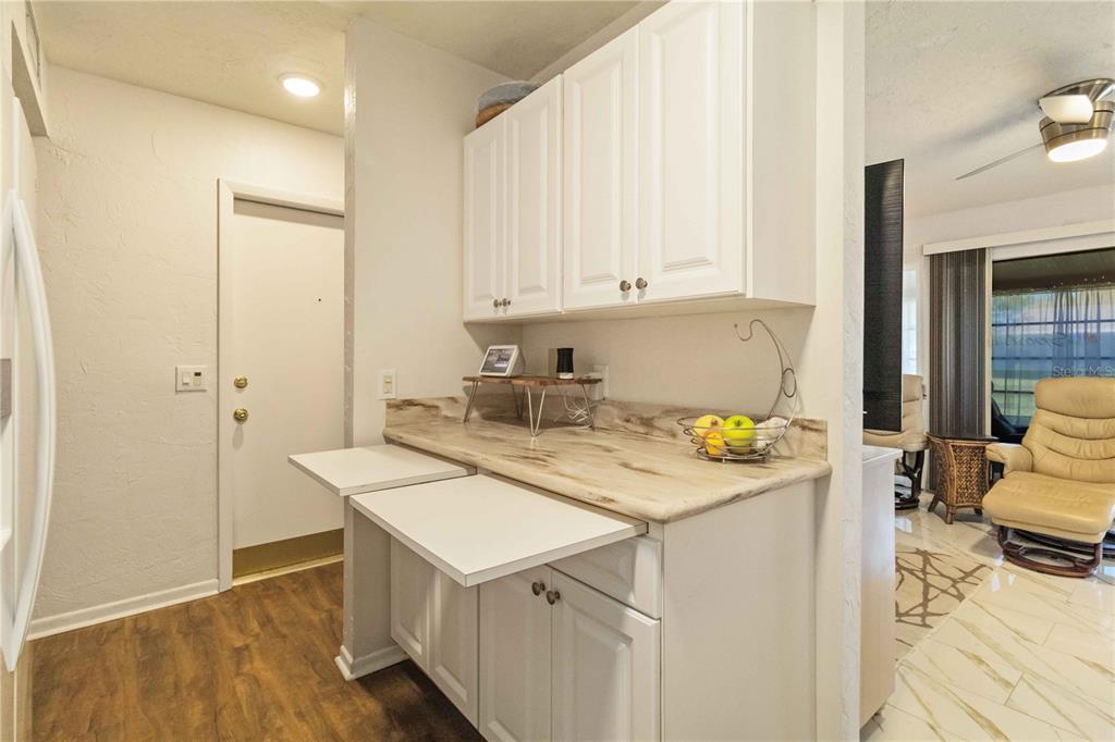 672 White Pine Tree Road, Unit 57 Venice, FL 34285 - Photo 13 of 57 a utility room with cabinets washer and dryer