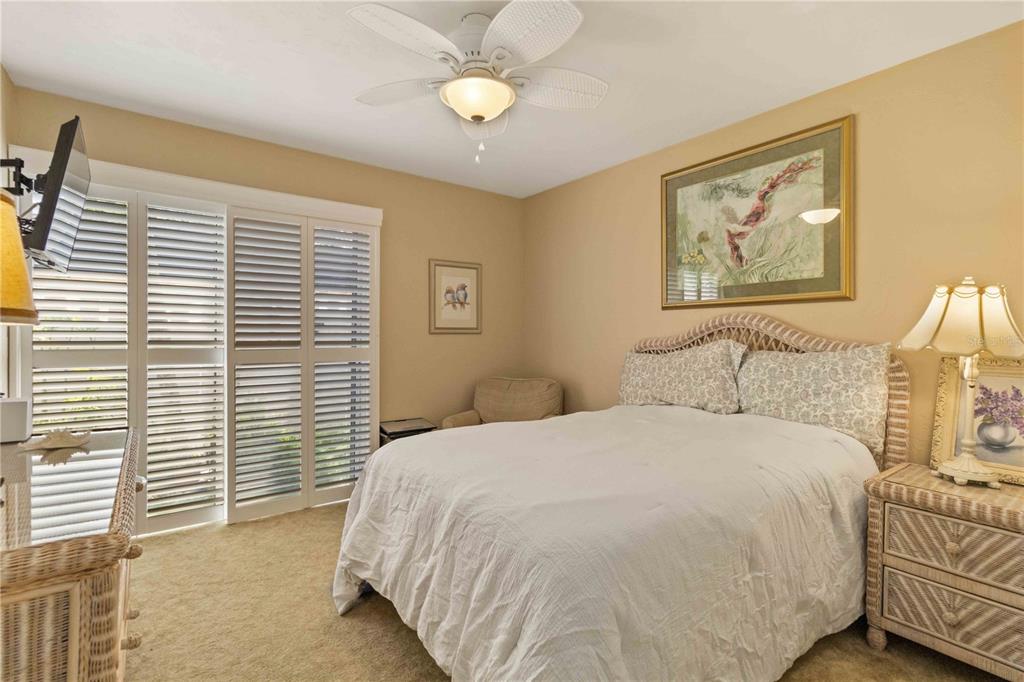 672 White Pine Tree Road, Unit 57 Venice, FL 34285 - Photo 20 of 57 a bedroom with a bed and a window