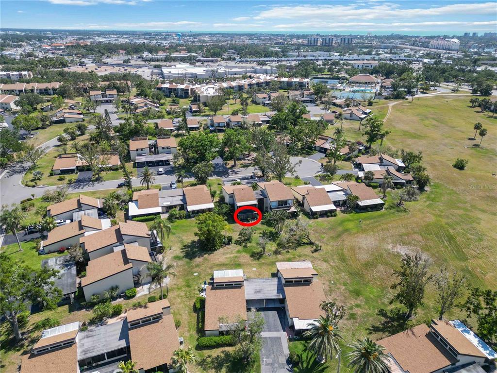 672 White Pine Tree Road, Unit 57 Venice, FL 34285 - Photo 2 of 57 an aerial view of residential houses with outdoor space