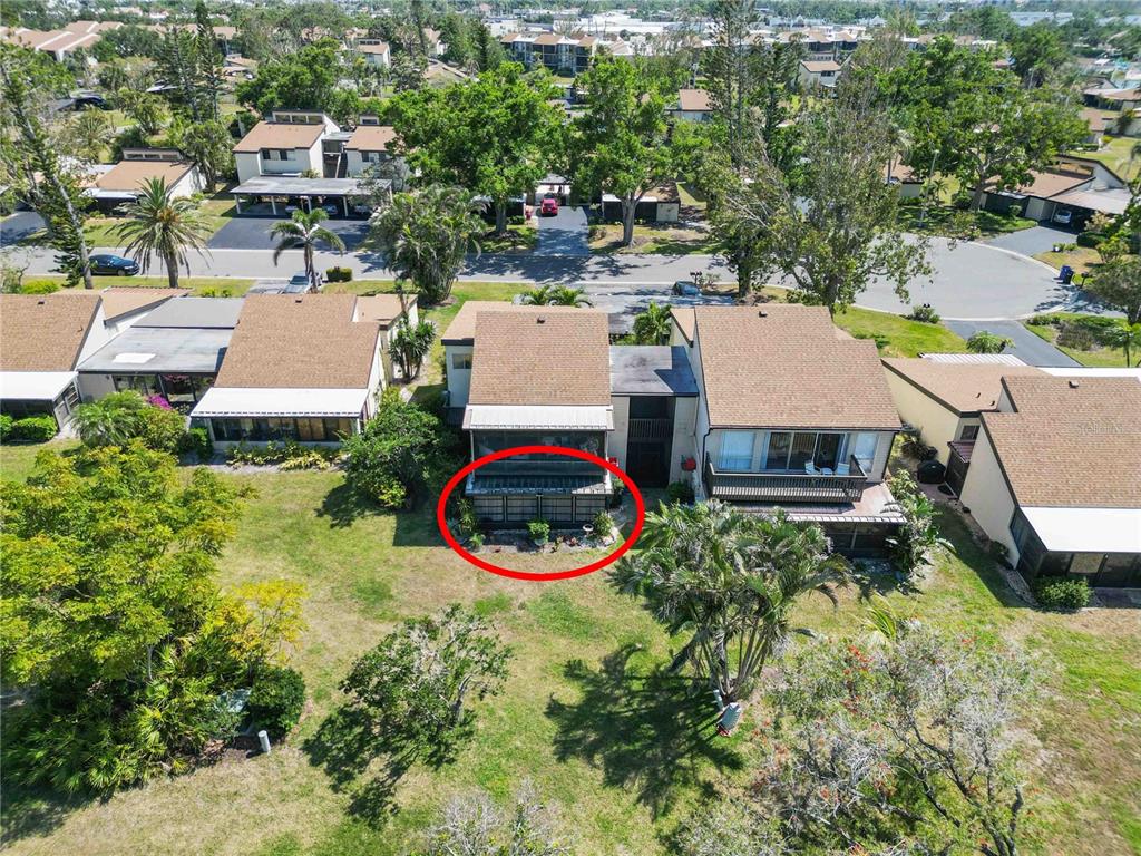 672 White Pine Tree Road, Unit 57 Venice, FL 34285 - Photo 31 of 57 an aerial view of a house with a yard and lake view