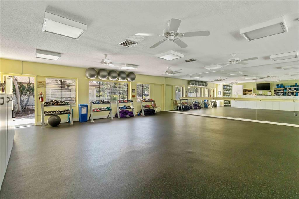 672 White Pine Tree Road, Unit 57 Venice, FL 34285 - Photo 37 of 57 a view of a livingroom with furniture and a flat screen tv