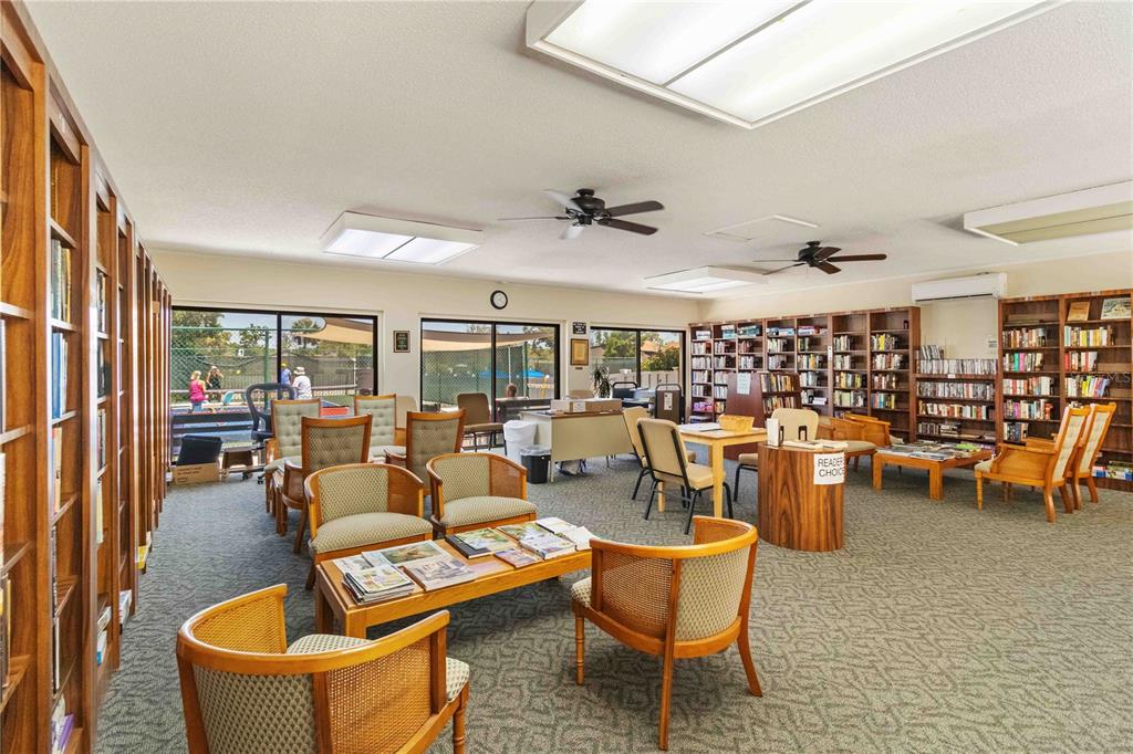672 White Pine Tree Road, Unit 57 Venice, FL 34285 - Photo 41 of 57 a living room with furniture and a large window