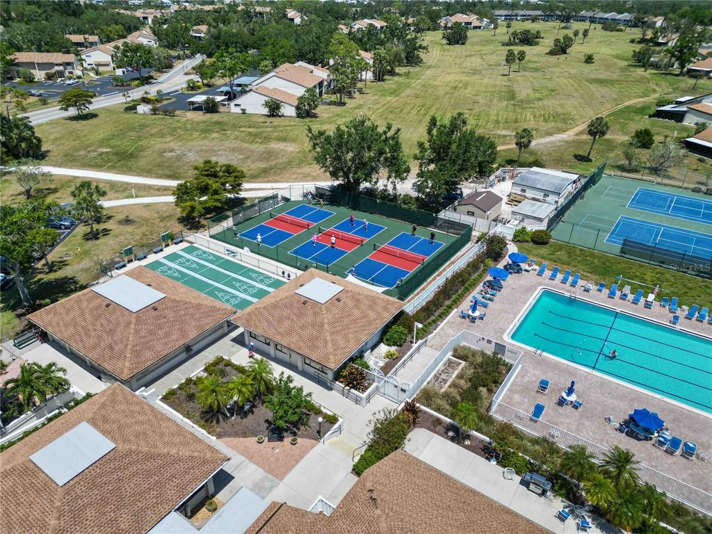 672 White Pine Tree Road, Unit 57 Venice, FL 34285 - Photo 45 of 57 an aerial view of a house with a garden