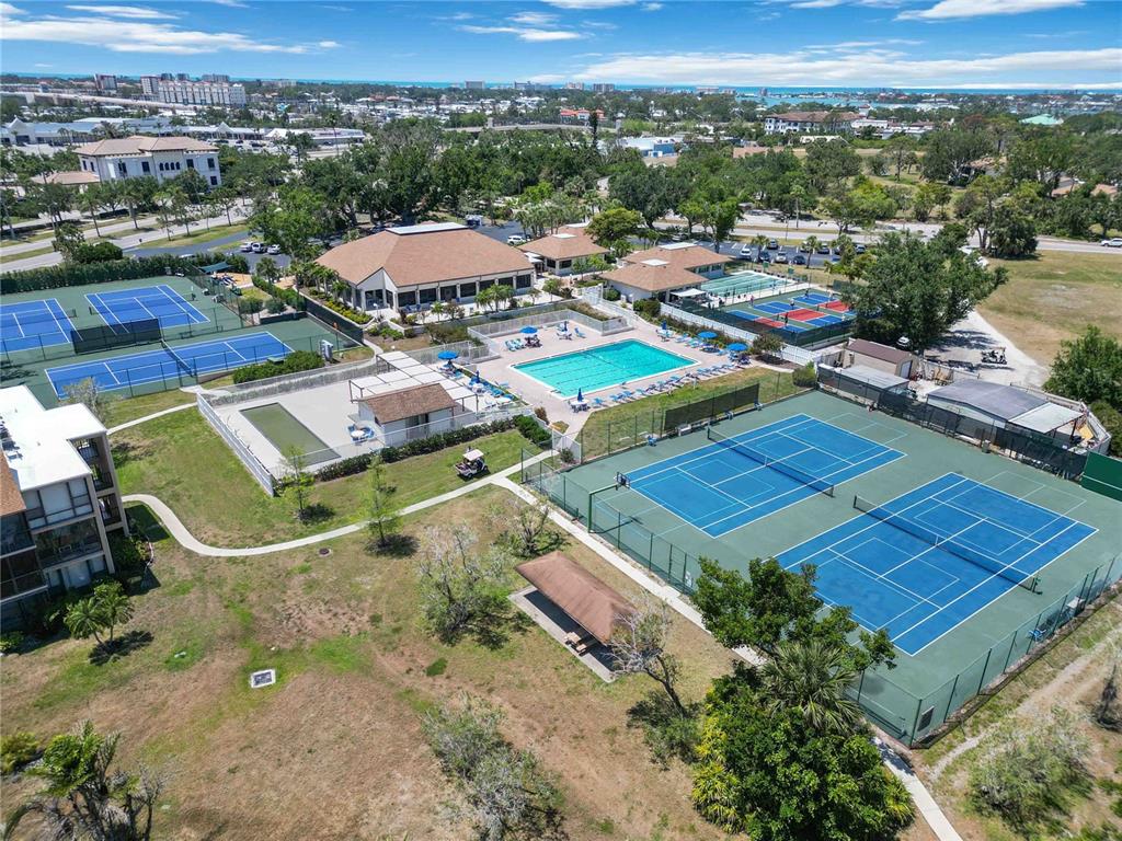 672 White Pine Tree Road, Unit 57 Venice, FL 34285 - Photo 47 of 57 an aerial view of a houses with a swimming pool