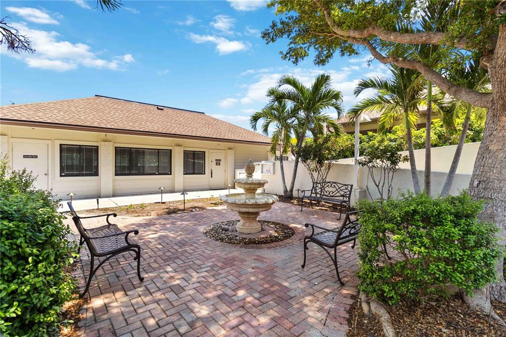 672 White Pine Tree Road, Unit 57 Venice, FL 34285 - Photo 53 of 57 a view of a backyard with sitting area