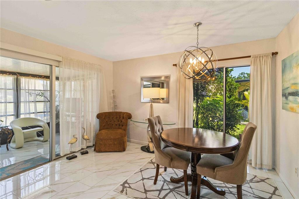 672 White Pine Tree Road, Unit 57 Venice, FL 34285 - Photo 6 of 57 a dining room with furniture and window