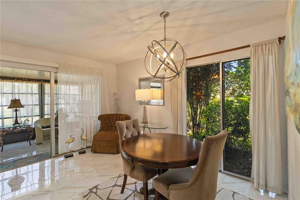 672 White Pine Tree Road, Unit 57 Venice, FL 34285 - Photo 8 of 57 a dining room with furniture window and outside view