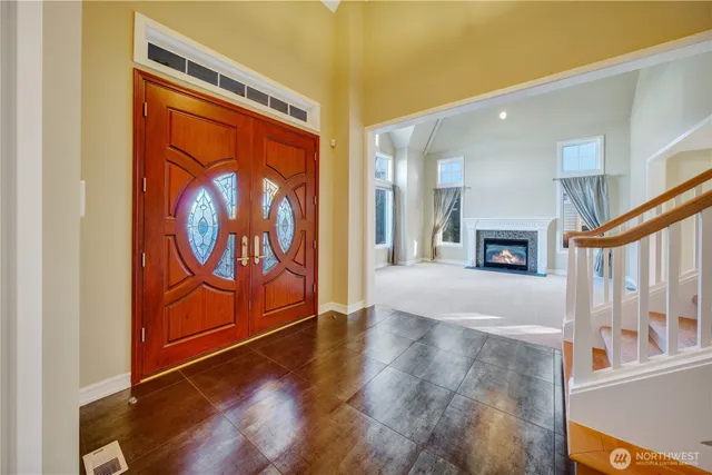 a view of an entryway with wooden floor
