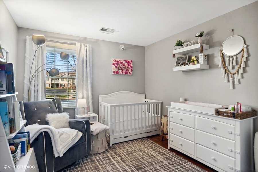 1345 East Evergreen Drive, Unit 3 Palatine, IL 60074 - Photo 11 of 13 a bedroom with a bed and a window