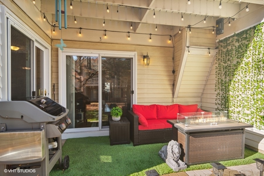 1345 East Evergreen Drive, Unit 3 Palatine, IL 60074 - Photo 13 of 13 a patio with table and chairs and potted plants