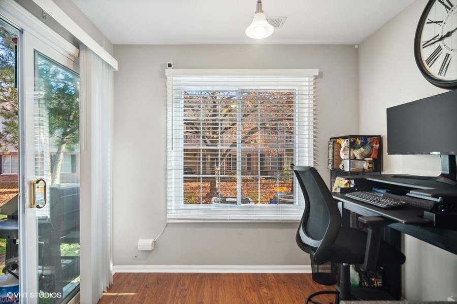 1345 East Evergreen Drive, Unit 3 Palatine, IL 60074 - Photo 7 of 13 a view of a workspace with furniture and a window