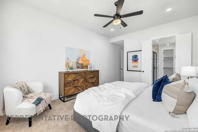 a bedroom with a bed and couch