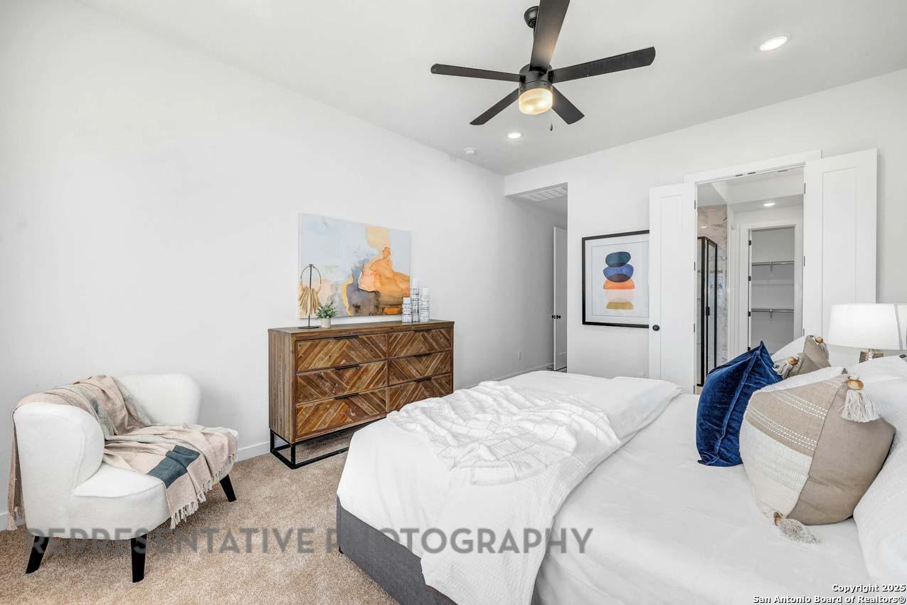 148 Spanish Oak Castroville, TX 78009 - Photo 10 of 19 a bedroom with a bed and couch