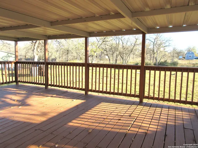 a view of outdoor space with wooden floor