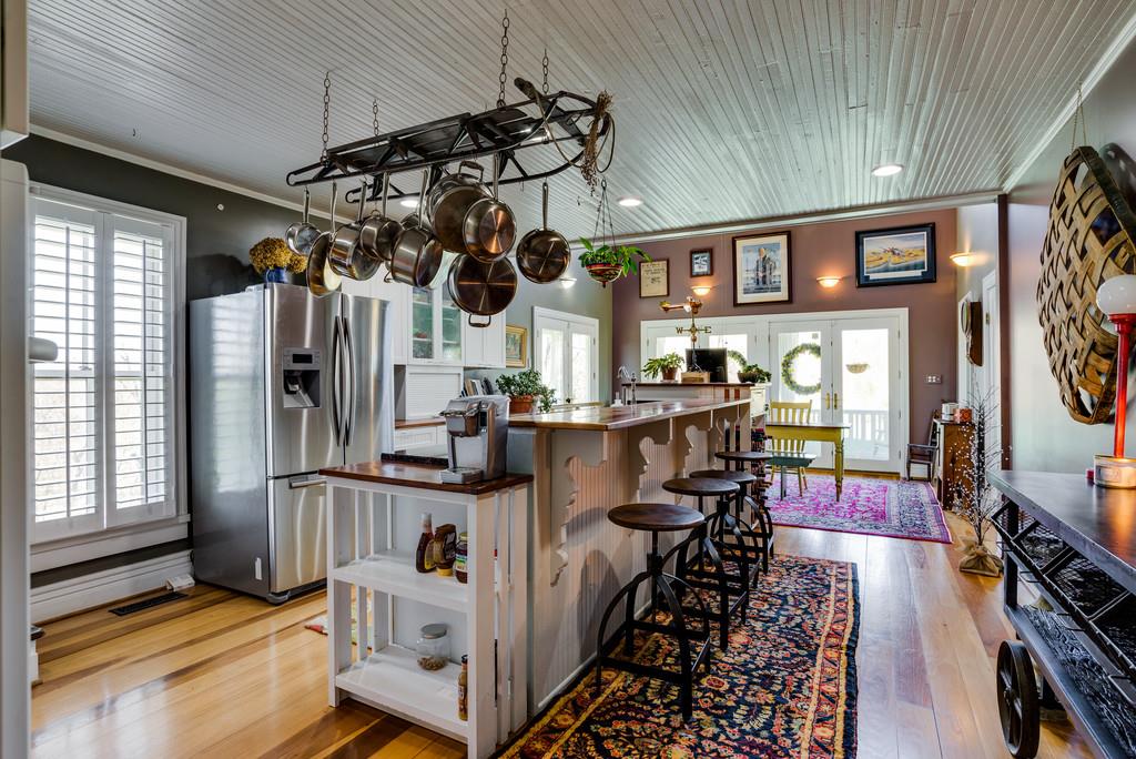 951 Gunter Ridge Road Pulaski, TN 38478 - Photo 7 of 25 Fabulous eat-in kitchen with granite counter tops, wood counter-tops, gas cook-top,heart of pine floors, bead board ceilings. Magnificent space to entertain.