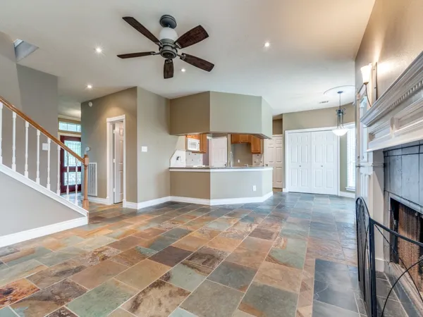 a view of a kitchen with a sink and a refrigerator