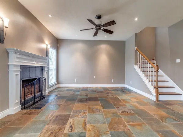 a view of an empty room and fire place