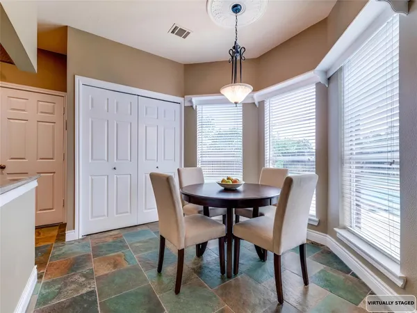 a view of a dining room with furniture window and outside view