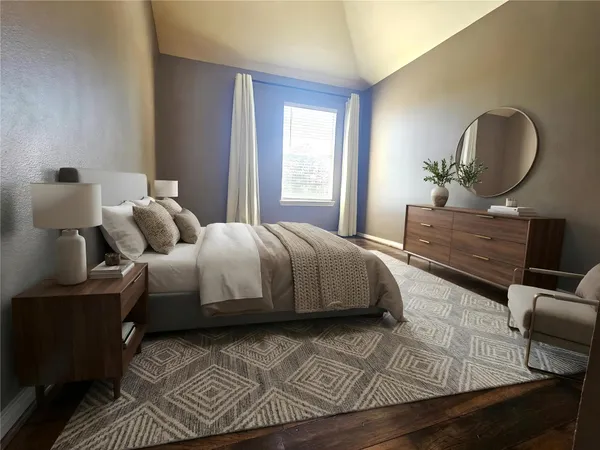 a bedroom with a bed and window