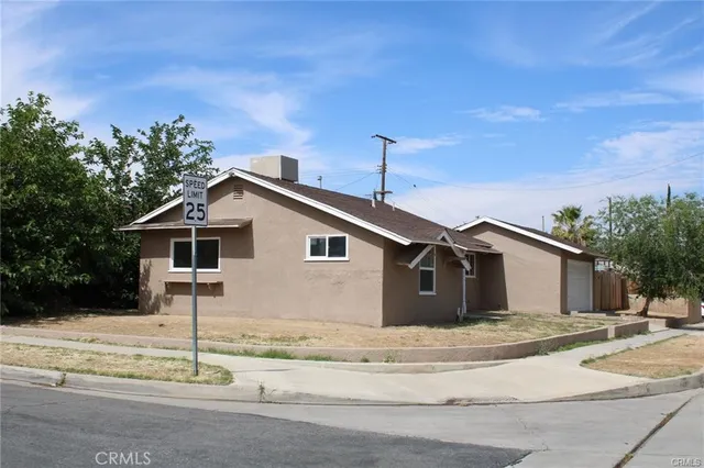 a view of a house with a fence