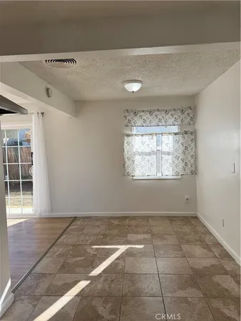 a kitchen with a sink a stove and cabinets