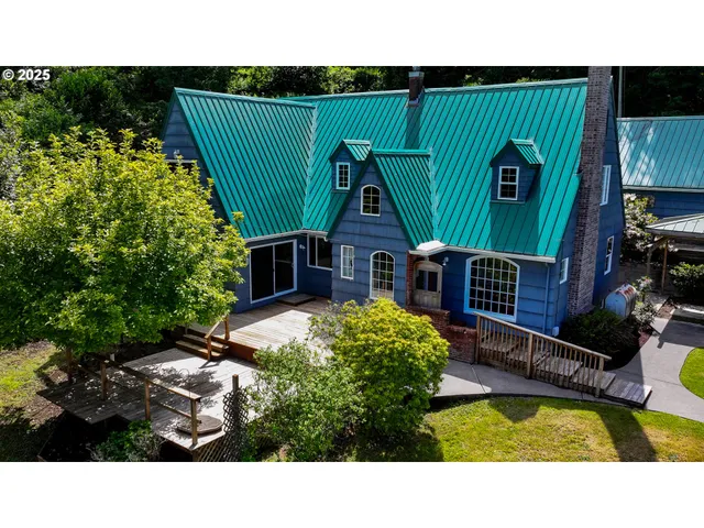 a picture of a house with a outdoor seating