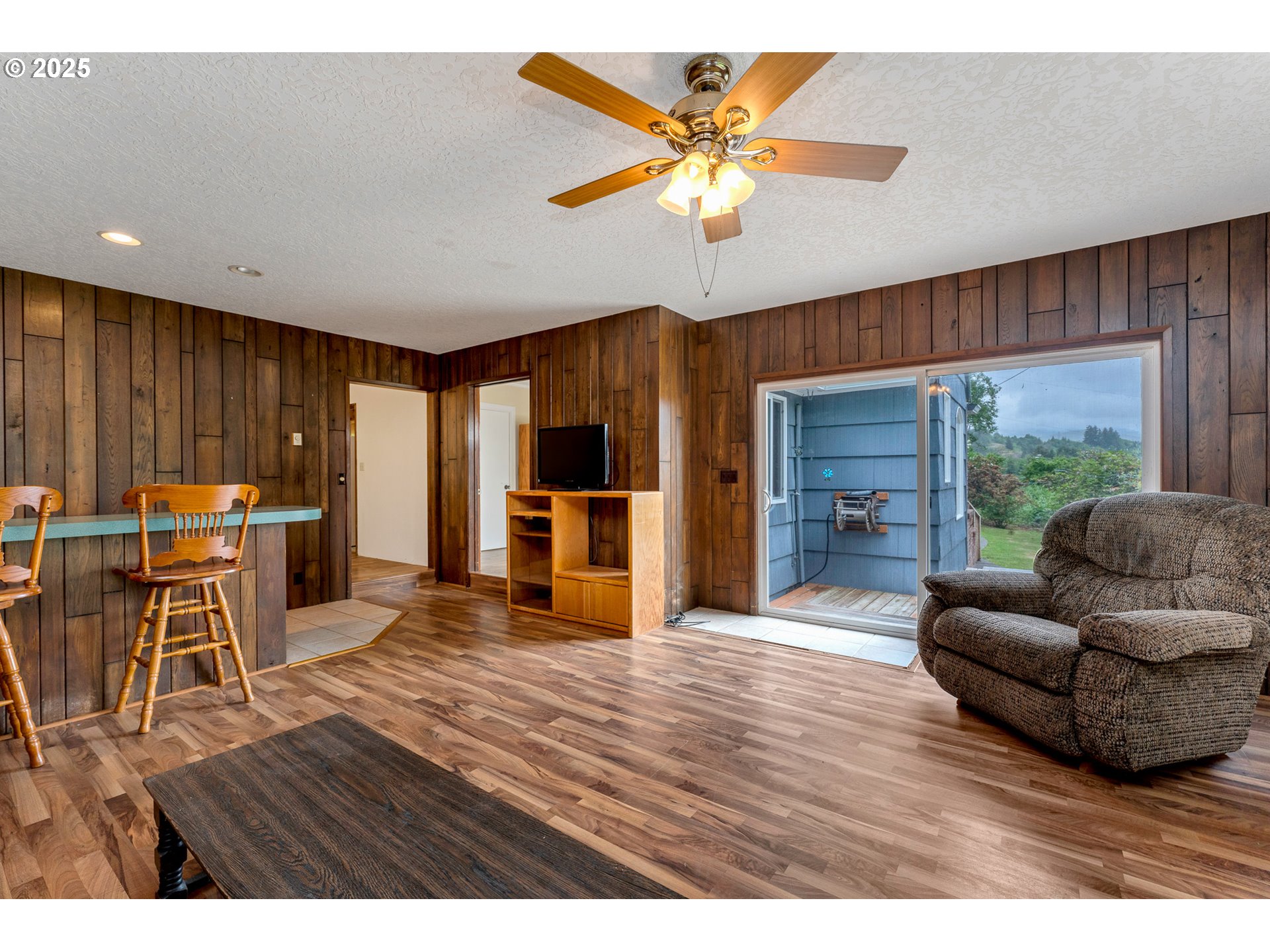 13005 I Street Nehalem, OR 97131 - Photo 13 of 45 a living room with furniture and a large window