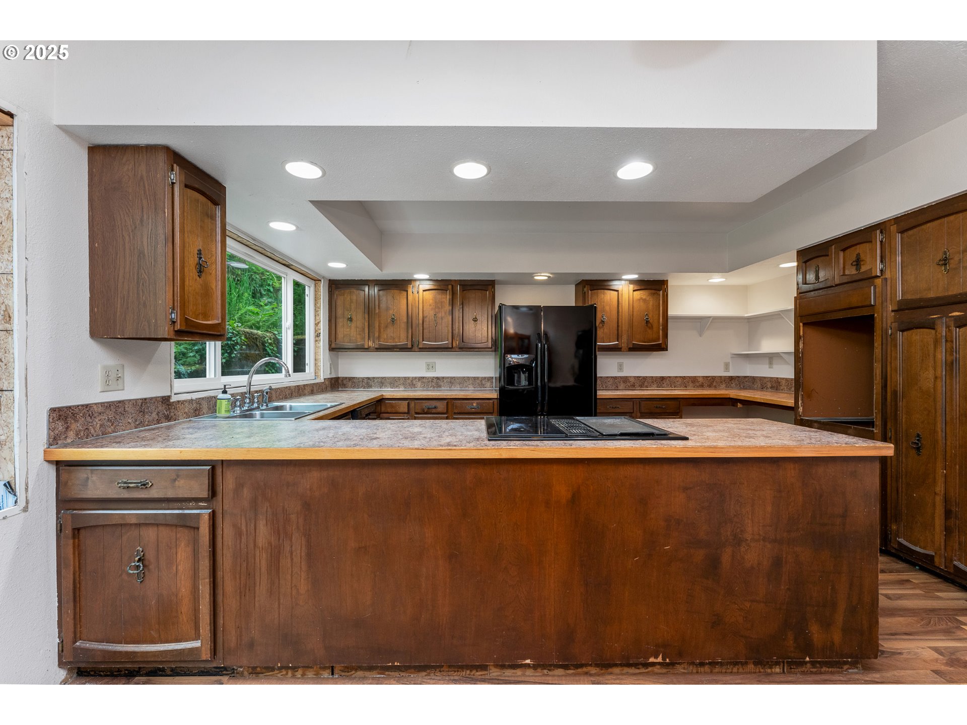 13005 I Street Nehalem, OR 97131 - Photo 15 of 45 a large kitchen with stainless steel appliances granite countertop a sink a stove and a refrigerator