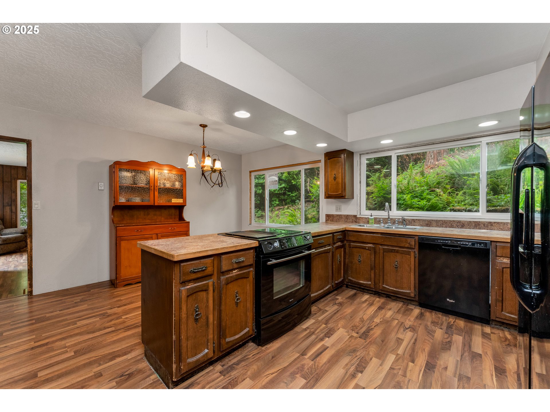 13005 I Street Nehalem, OR 97131 - Photo 16 of 45 a kitchen with a stove a sink and a microwave