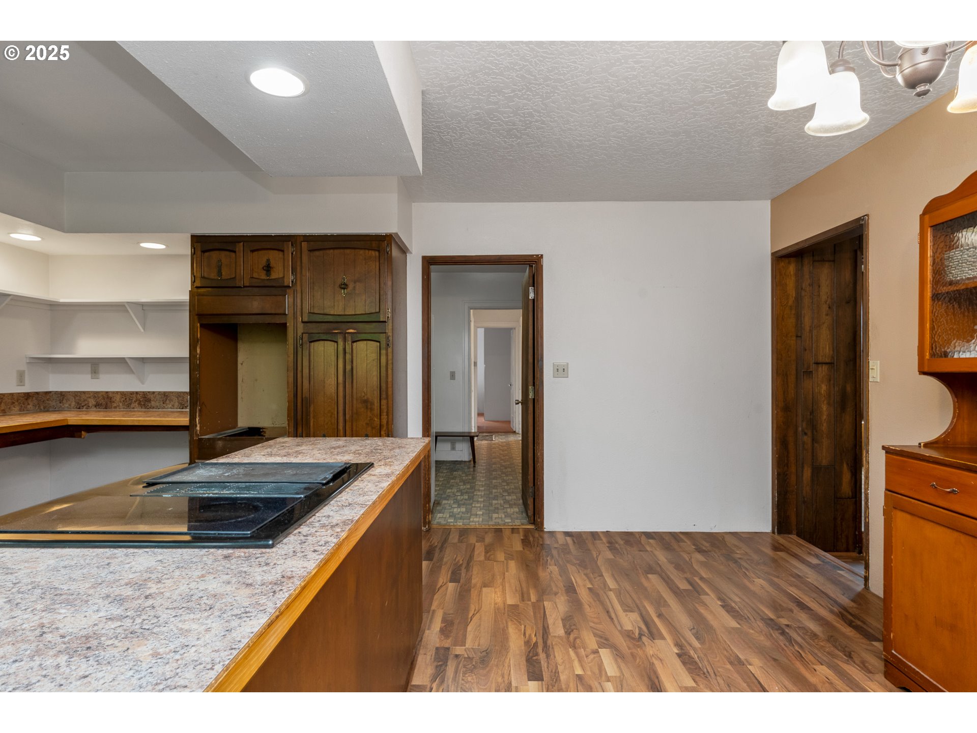 13005 I Street Nehalem, OR 97131 - Photo 17 of 45 a kitchen view with granite countertop a sink and a stove top oven