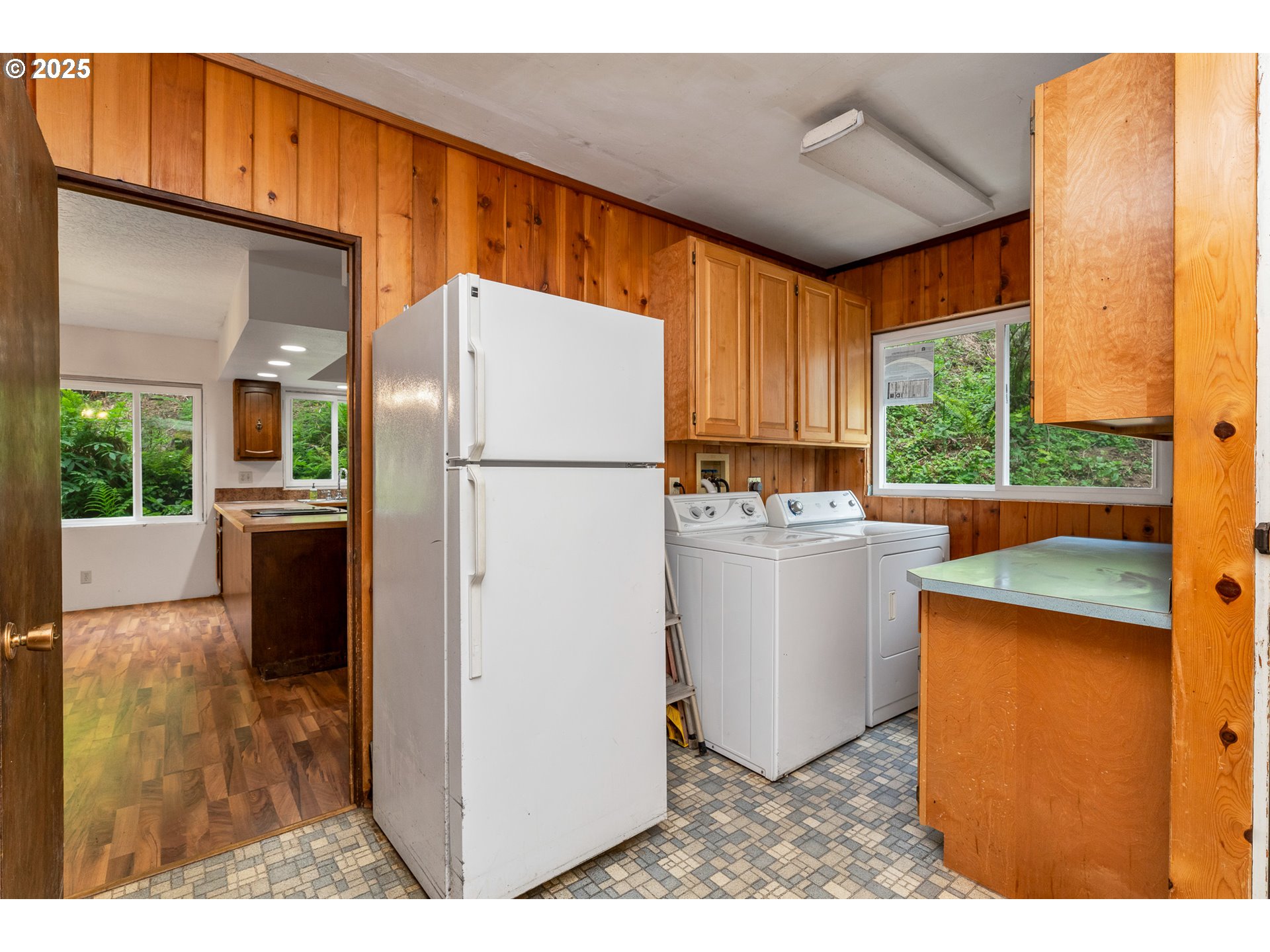 13005 I Street Nehalem, OR 97131 - Photo 18 of 45 a kitchen with refrigerator and cabinets