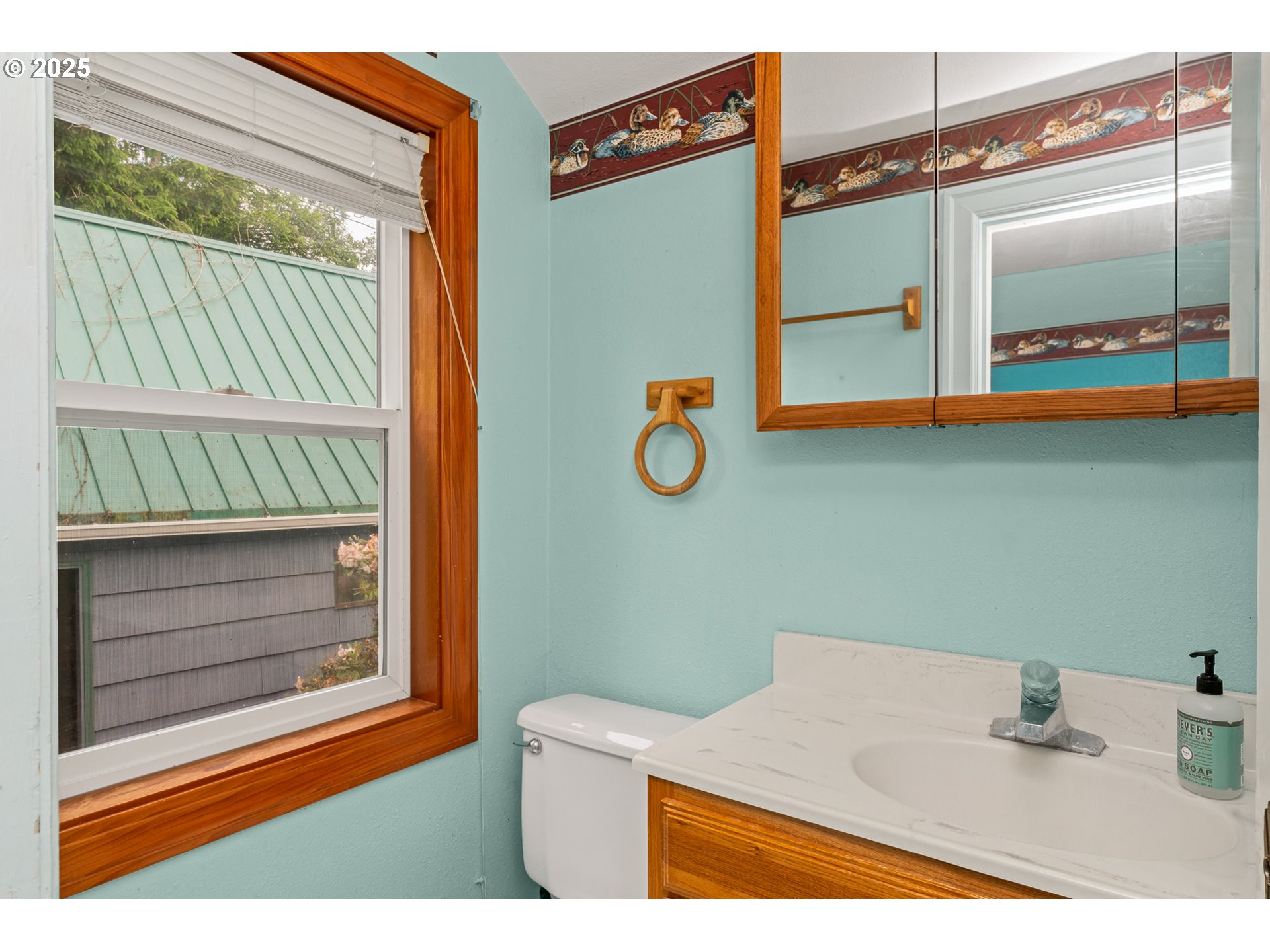 13005 I Street Nehalem, OR 97131 - Photo 22 of 45 a bathroom with a sink and a mirror