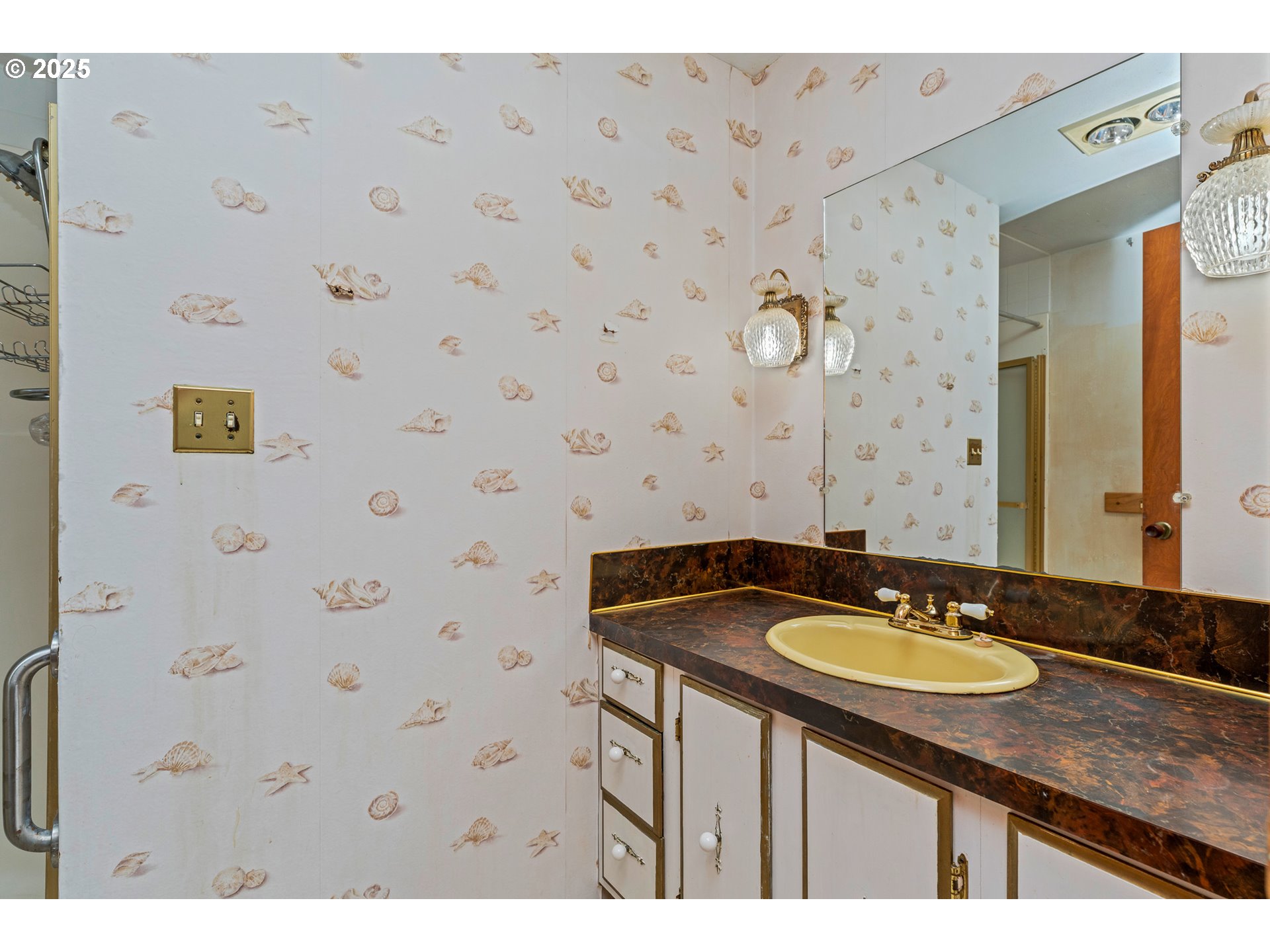 13005 I Street Nehalem, OR 97131 - Photo 29 of 45 a bathroom with a granite countertop sink and a mirror