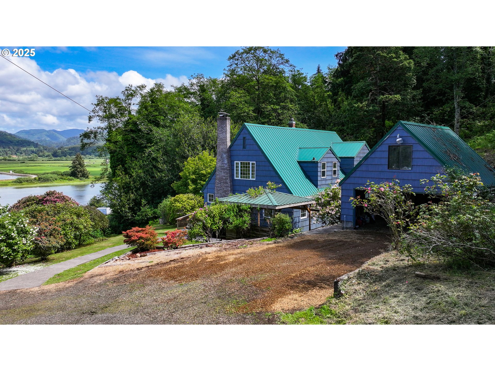 13005 I Street Nehalem, OR 97131 - Photo 3 of 45 a aerial view of a house with a yard and table