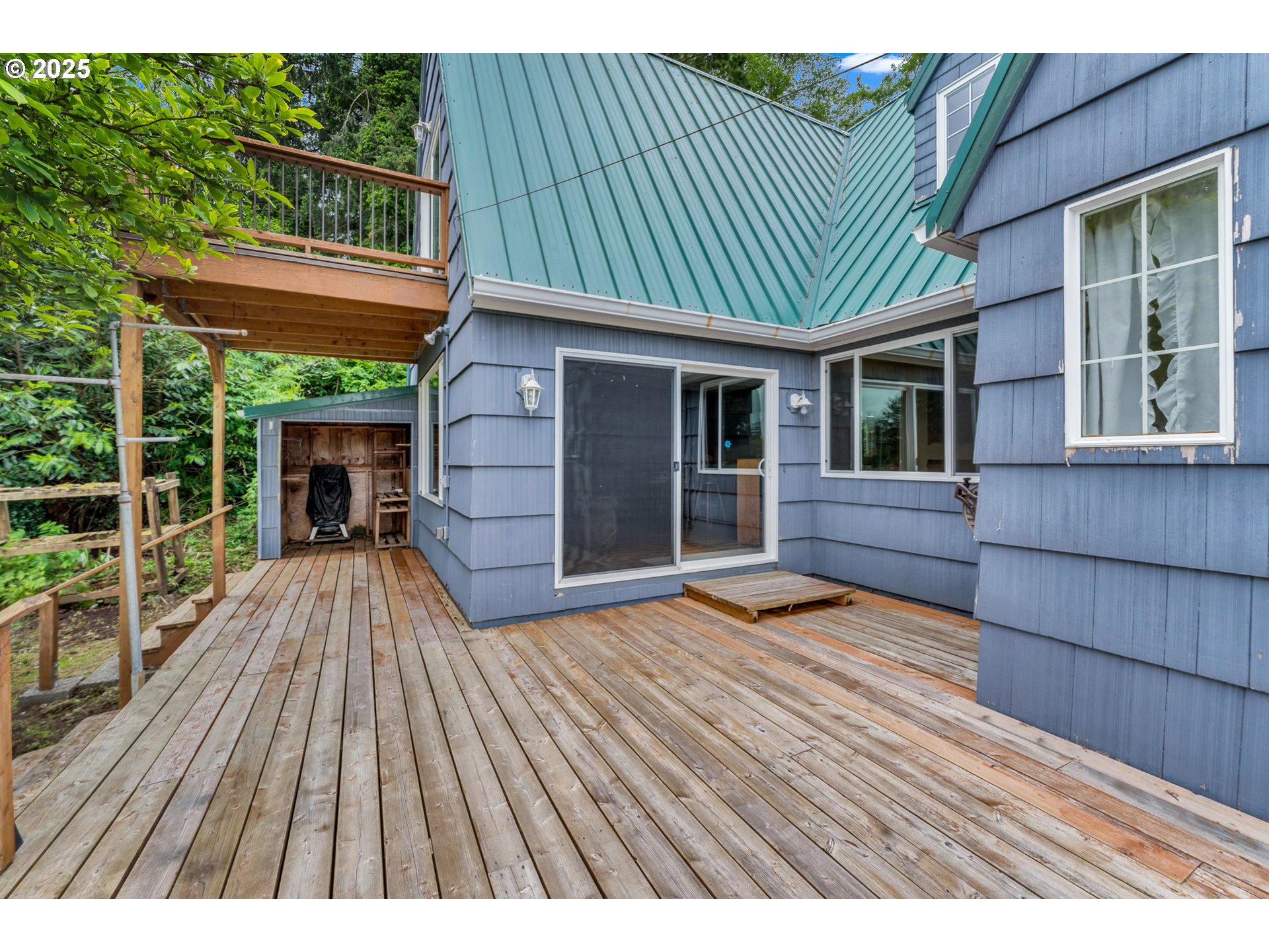 13005 I Street Nehalem, OR 97131 - Photo 32 of 45 a view of backyard with a deck and wooden floor