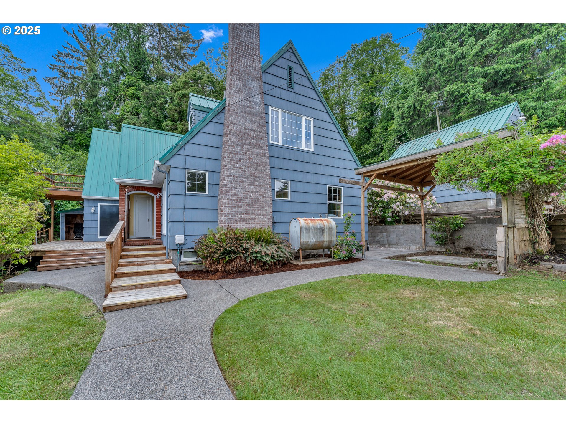 13005 I Street Nehalem, OR 97131 - Photo 33 of 45 a front view of a house with a garden