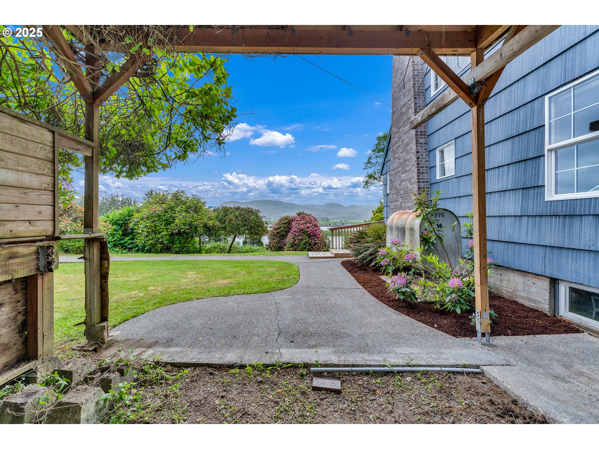 13005 I Street Nehalem, OR 97131 - Photo 35 of 45 a view of a garden with an outdoor space